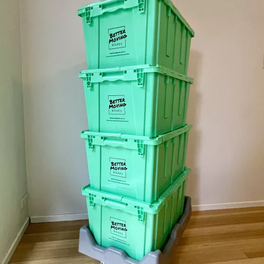Four crates stacked on dolly
