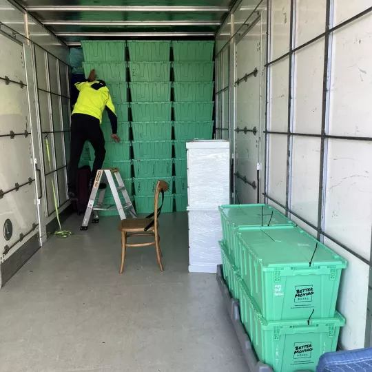 Stacking crates inside moving truck