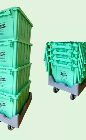Boxes stacked within and on top of one another on dollies
