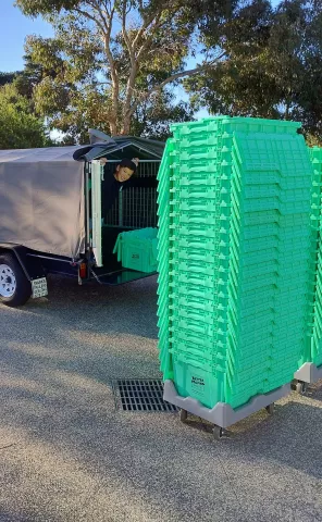 Moving boxes being loaded into a trailer